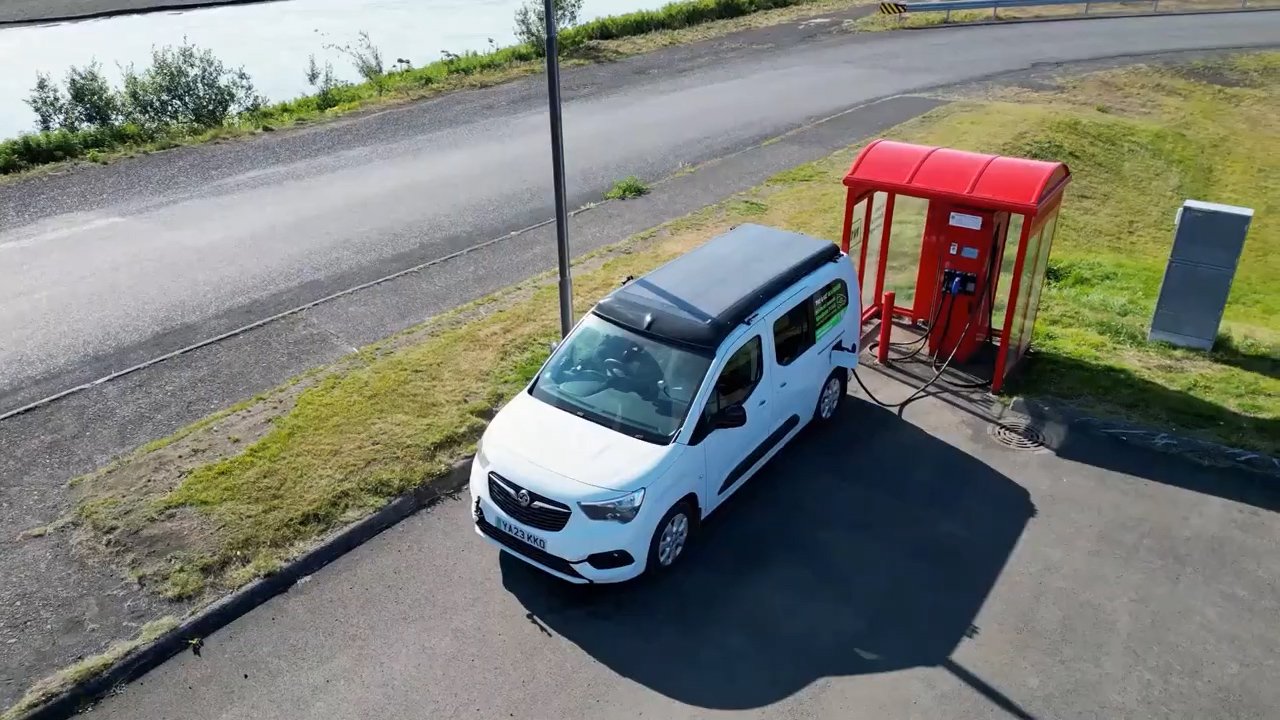 Topping up at one of Iceland's chargers — the solar panel visible on the roof